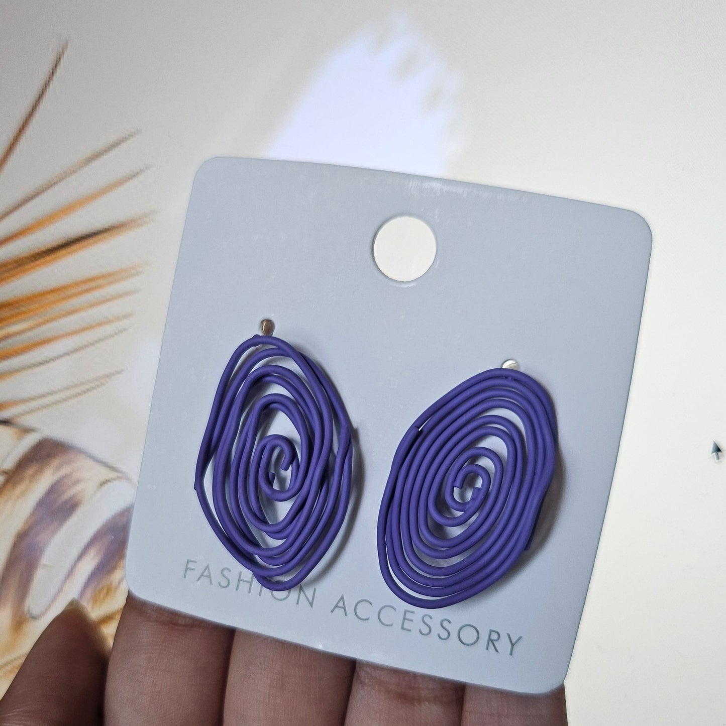 Violet Coil Fashion Statement Studs