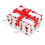 Gift box with red ribbon and heart pattern, shown with dimensions on a white background