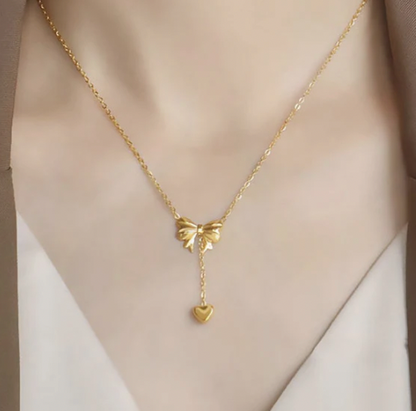 Gold Plated Stainless Steel Anti Tarnish Heart Themed Bow inspired Pendant Necklace