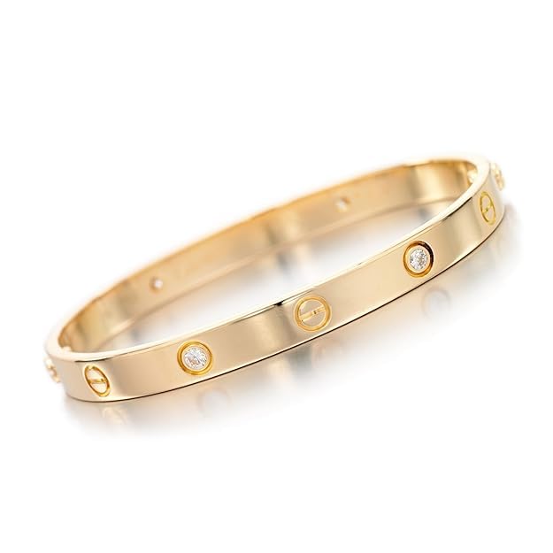 Gold bracelet with diamond accents on a white background