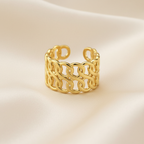 Gold Interlocking Wave Chain Wide Cuff Open Ring - cream silk fabric close-up
