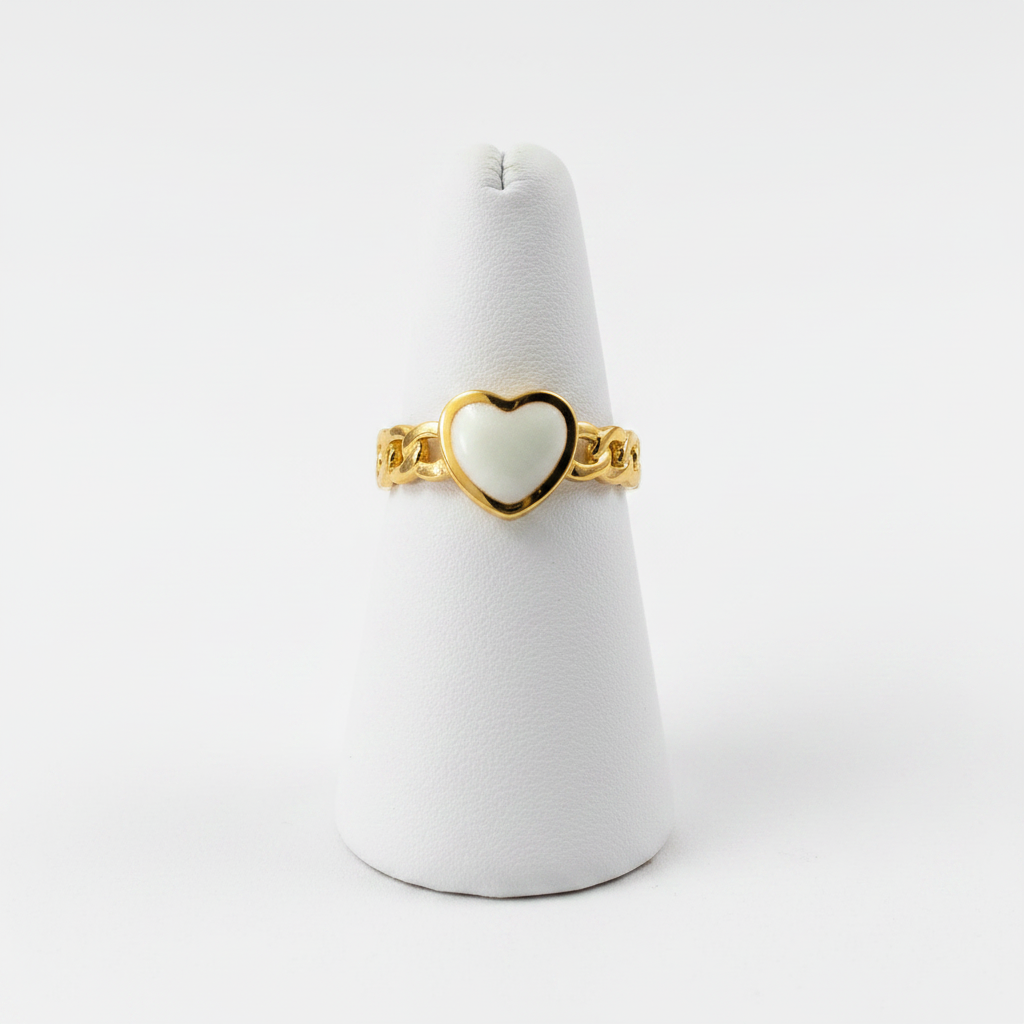 Gold chain link band white enamel heart open cuff ring on white jewelry stand, clean studio shot