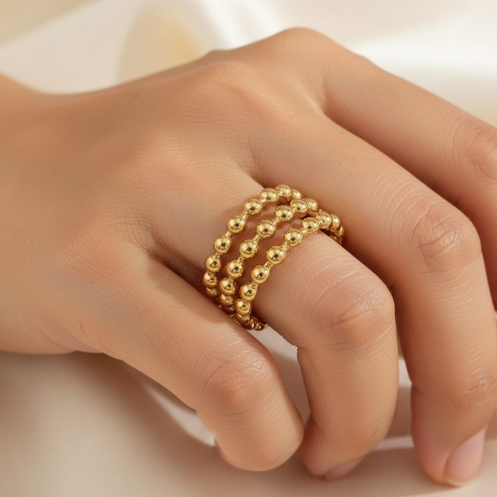 Gold Triple Row Beaded Wide Cuff Open Ring - worn on finger cream background lifestyle shot