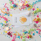 Flat lay composition of bro-tato birthday card with envelope and celebration decorations