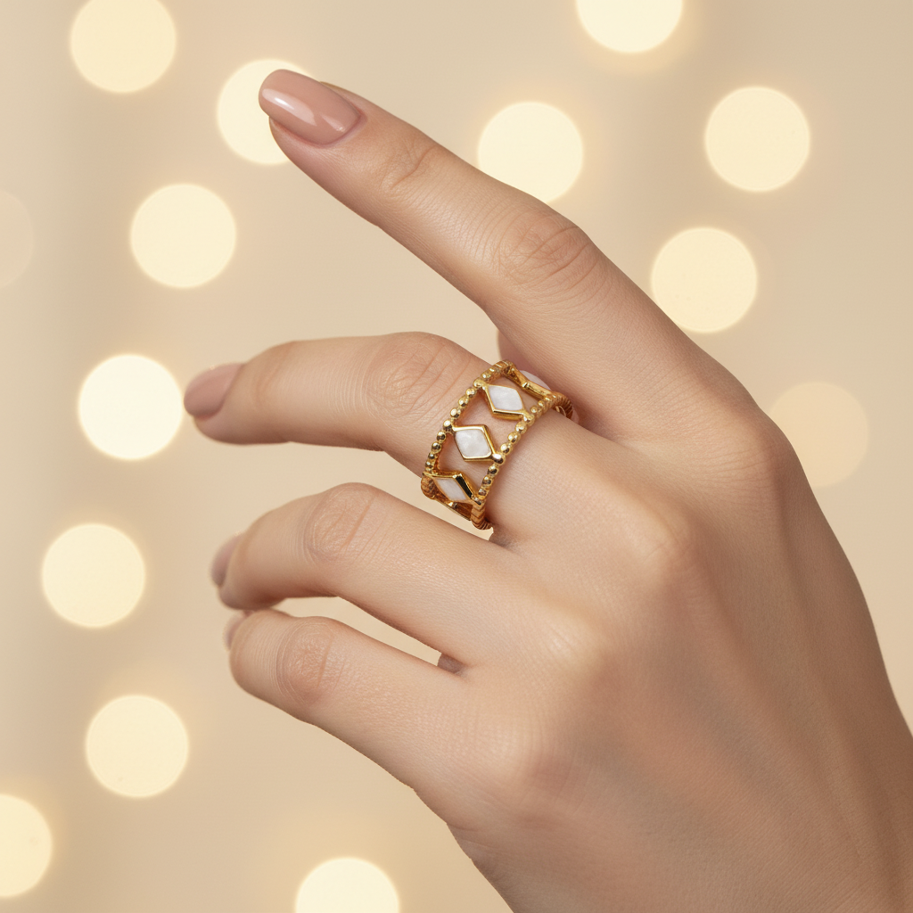 Gold diamond cutout lace crown ring worn on woman's finger