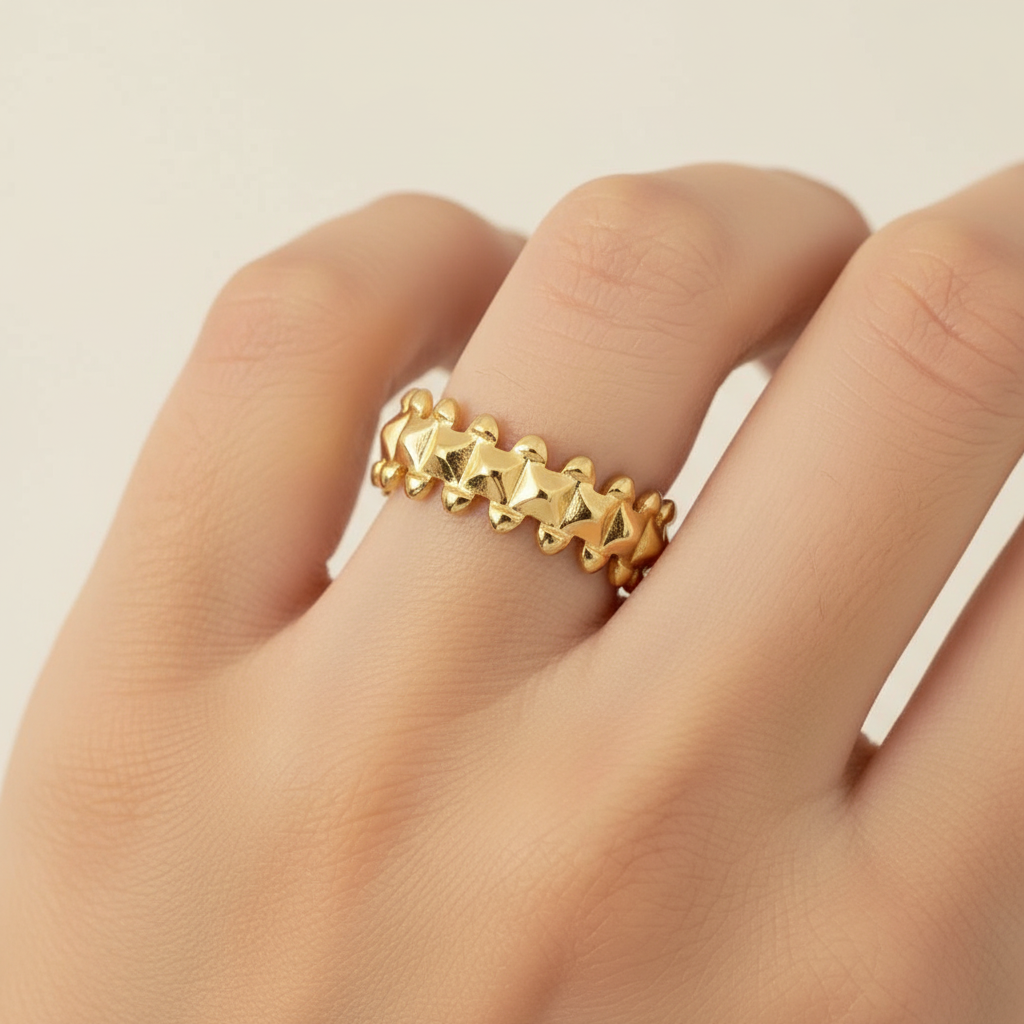 Gold Double Spike Pyramid Crown Open Cuff Ring - worn on finger cream background lifestyle shot