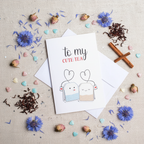 Flat lay composition of tea greeting card with envelope and decorative elements