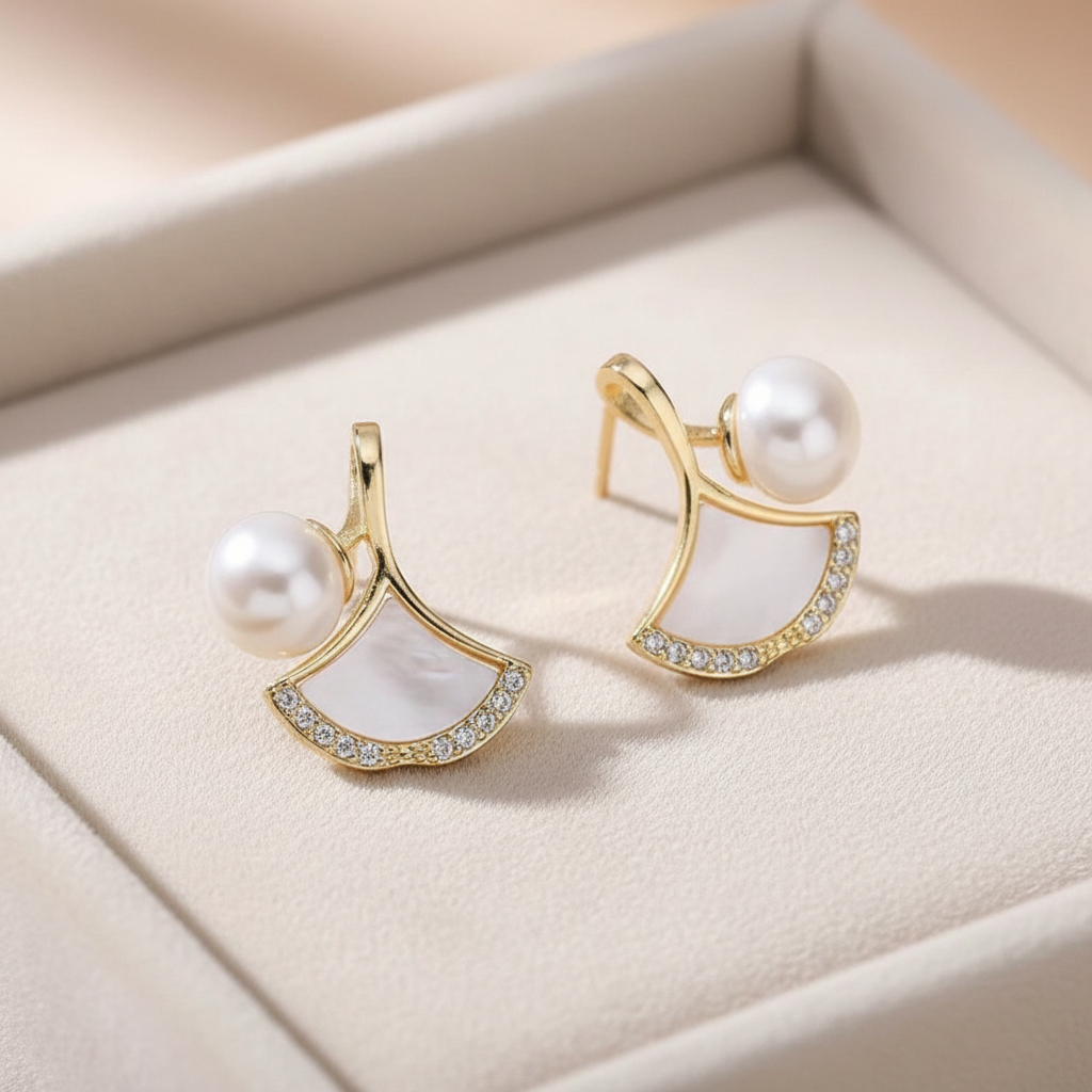 Pearl & Shell Fan Stud Earrings on cream velvet tray