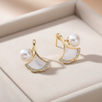 Pearl & Shell Fan Stud Earrings on cream velvet tray