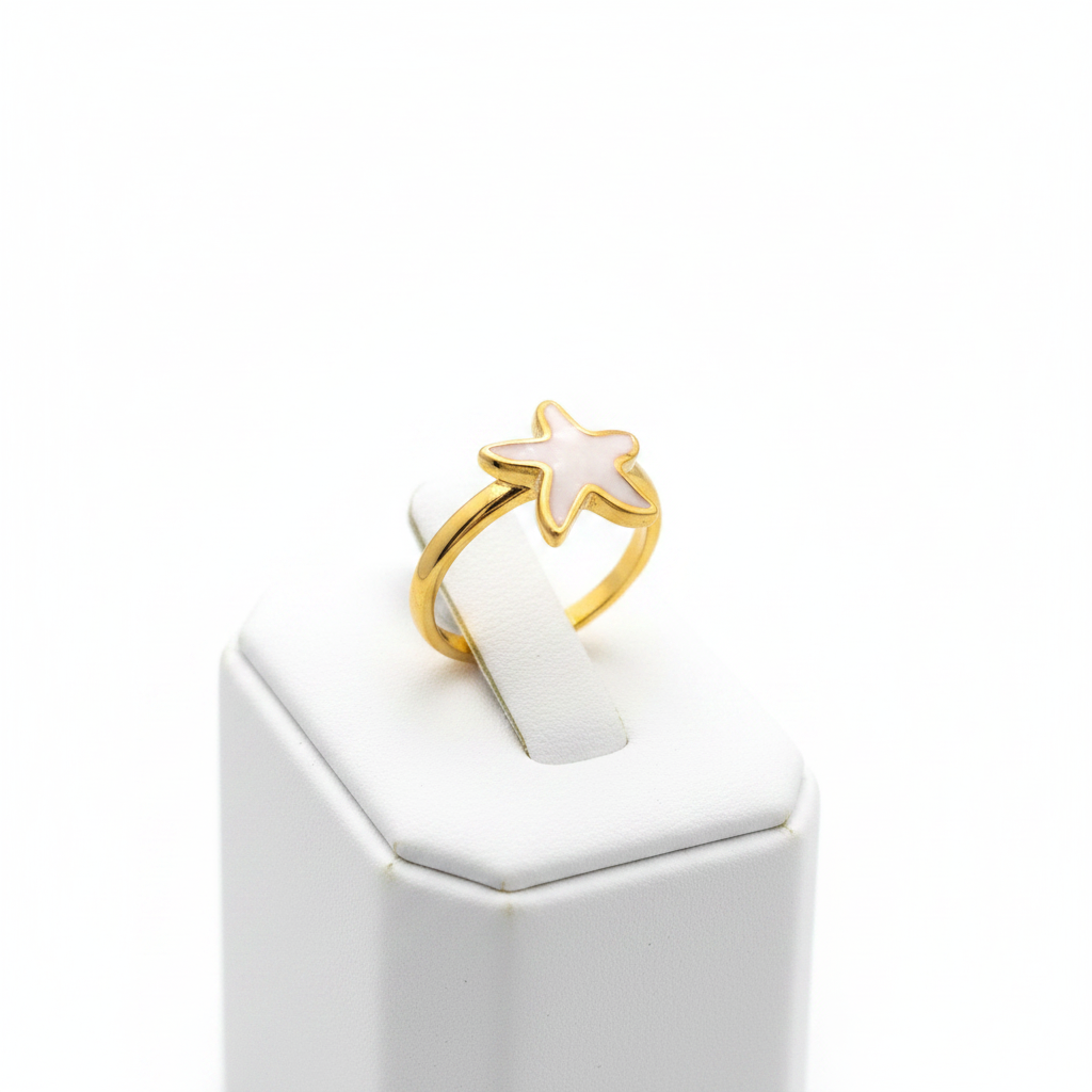 Gold white enamel starfish open cuff ring on white jewelry stand, clean studio shot