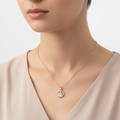 Model wearing Violet Vows gold chain necklace with Eiffel Tower crystal pendant