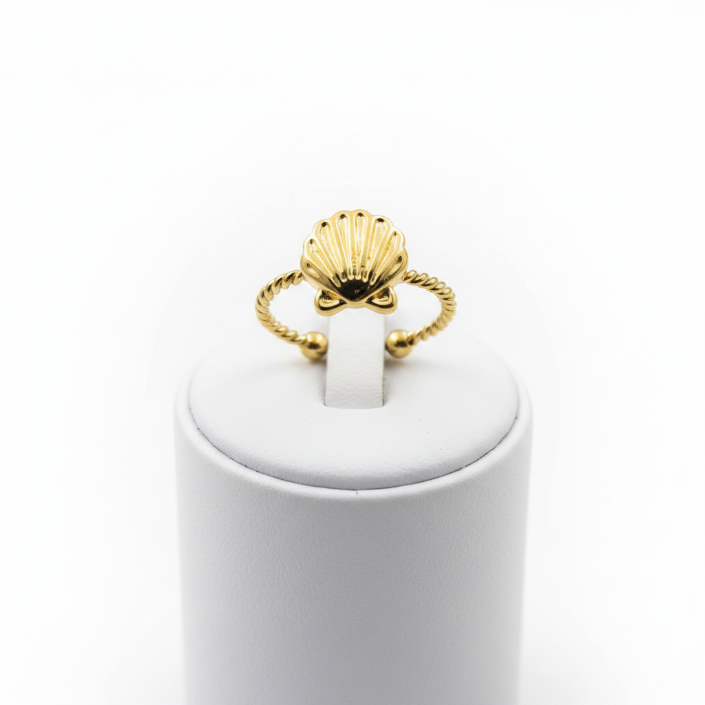 Gold seashell twisted rope open cuff ring on white jewelry stand, clean studio shot