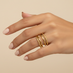 Gold Twisted Rope & Smooth Multi-Band Open Cuff Ring - worn on finger cream background lifestyle shot
