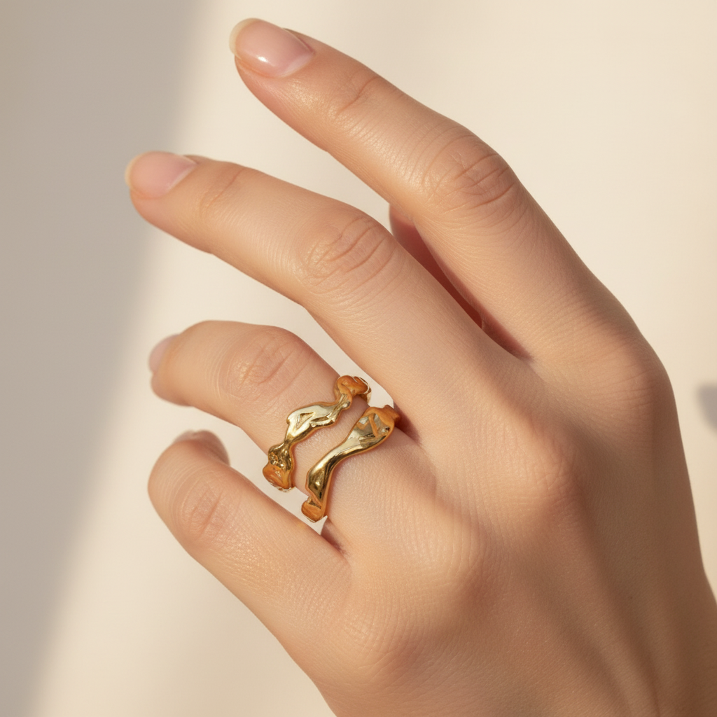 Gold Molten Lava Double Wave Open Cuff Ring - worn on finger cream background lifestyle shot