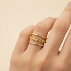 Gold Triple Band Daisy Chain Open Ring - worn on finger cream background lifestyle shot