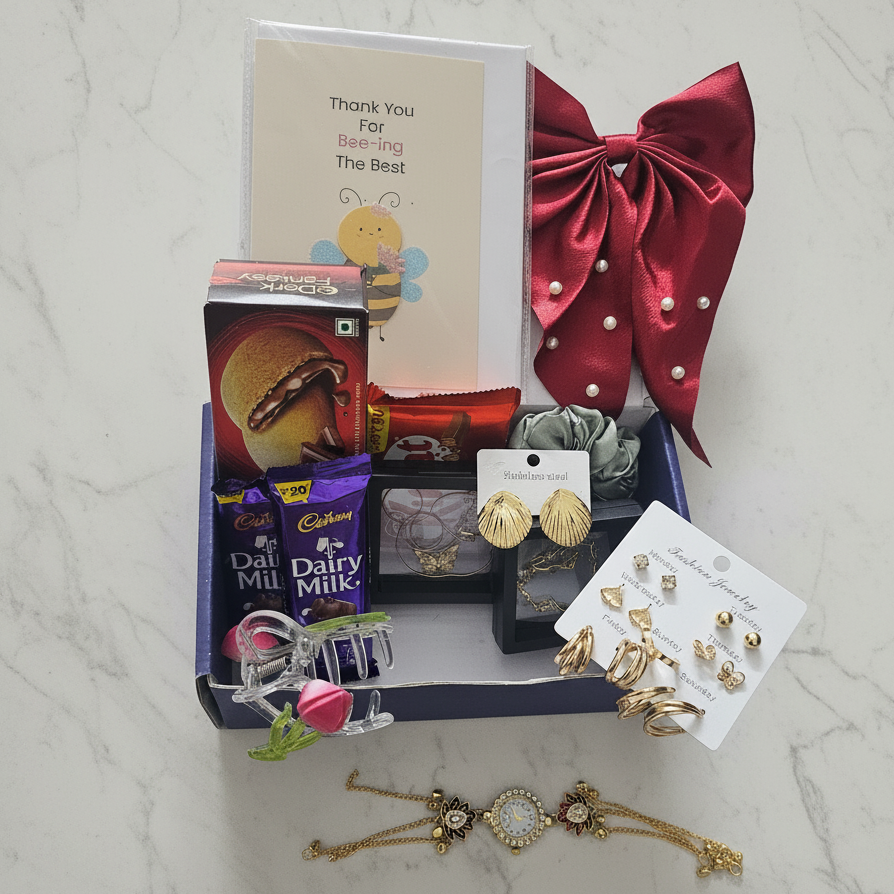 Violet Vows gift packaging shot showing gold jewelry sets, chocolates, hair accessories, and a card