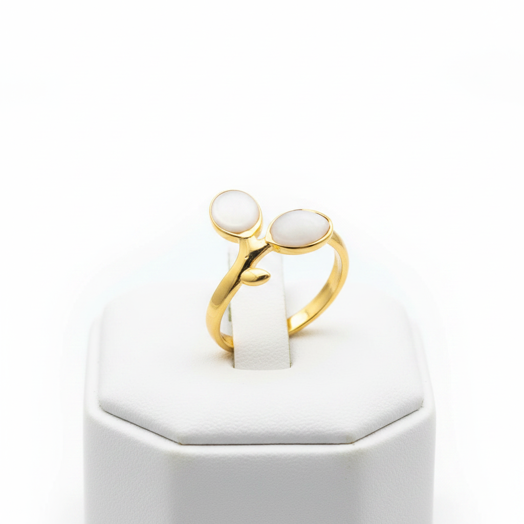Gold double oval stone bypass open cuff ring on white jewelry stand, clean studio shot