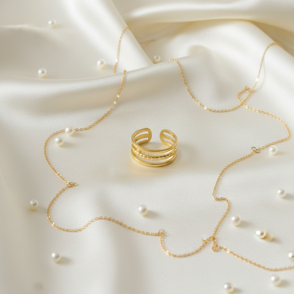 Gold triple layer open cuff ring on ivory silk with pearls and gold chain