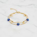 Gold Double Layer Evil Eye & Coin Charm Bracelet - white marble product shot