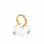 Gold open heart cutout band open cuff ring on white jewelry stand, clean studio shot