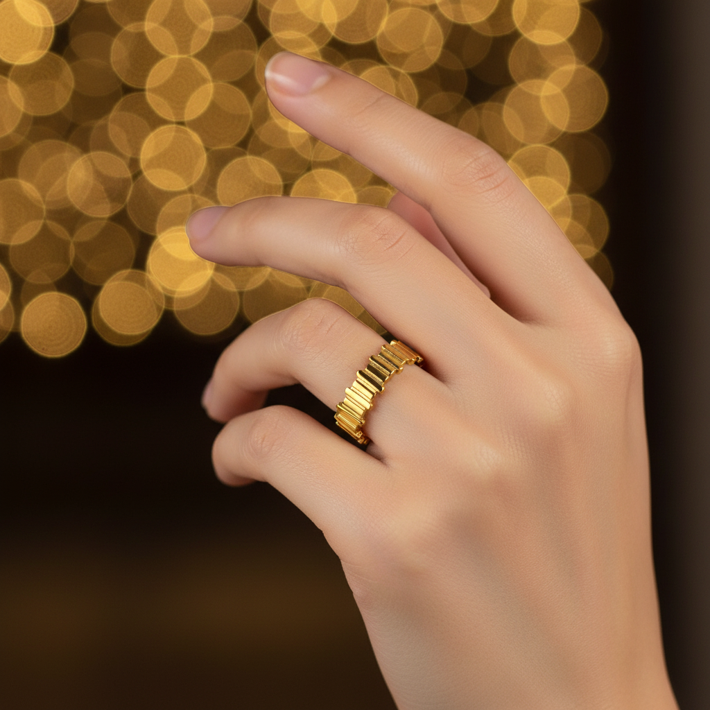 Gold vertical bar link wide band open cuff ring worn on finger with warm golden bokeh