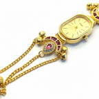 Peacock Charm Bracelet Watch Ruby Edition – close-up detail shot