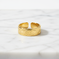 Gold Engraved Evil Eye Sunburst Wide Band Open Ring - white marble product shot