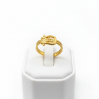 Gold belt buckle braided chain open cuff ring on white jewelry stand, clean studio shot