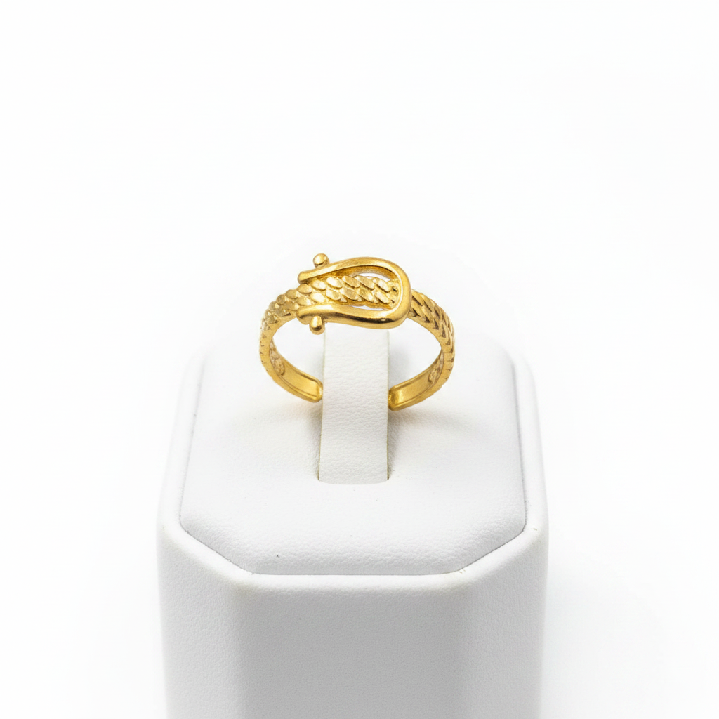 Gold belt buckle braided chain open cuff ring on white jewelry stand, clean studio shot
