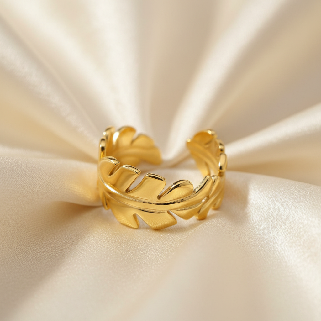 Gold Feather Leaf Open Ring - cream silk fabric close-up