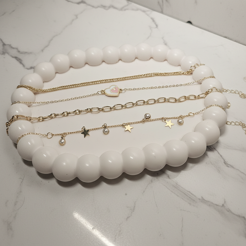4-Piece Gold Bracelet Set - Marble Flat Lay