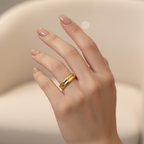 Gold double layer open band ring worn on woman's finger