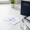Greeting Card lifestyle photo with science lab equipment and chemistry books