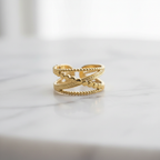 Gold double layer beaded heart open cuff ring on white marble surface