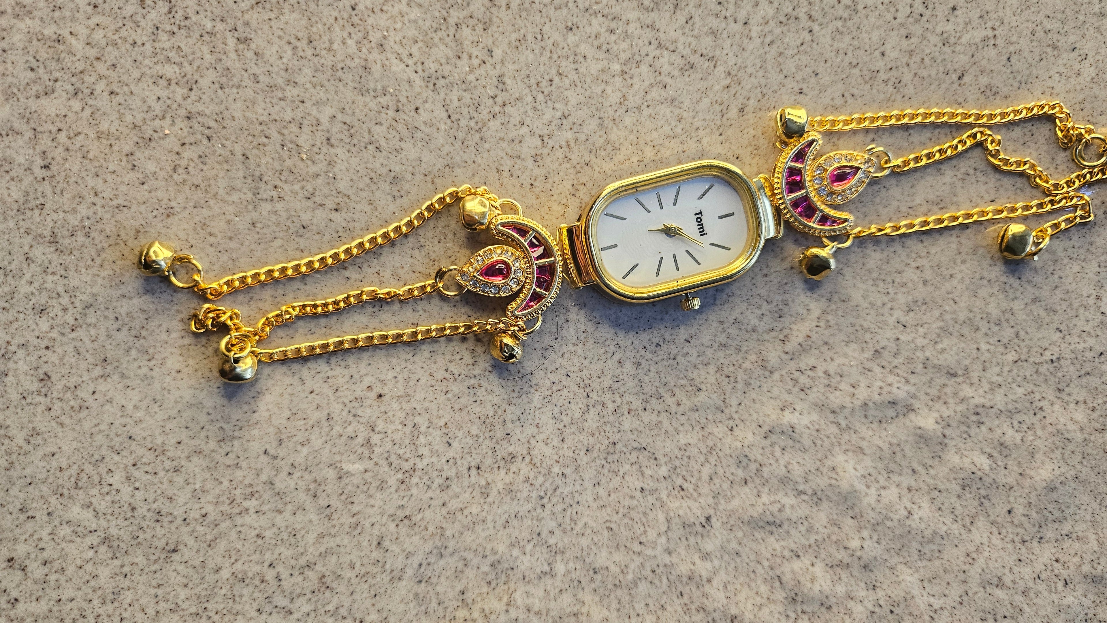 Peacock Charm Bracelet Watch Gold Plated with ruby stone accents and bell charms