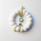 Teal flower bracelet watch flat lay