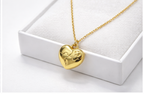 Violet Vows gold heart pendant necklace with sculpted heart detail in a gift box